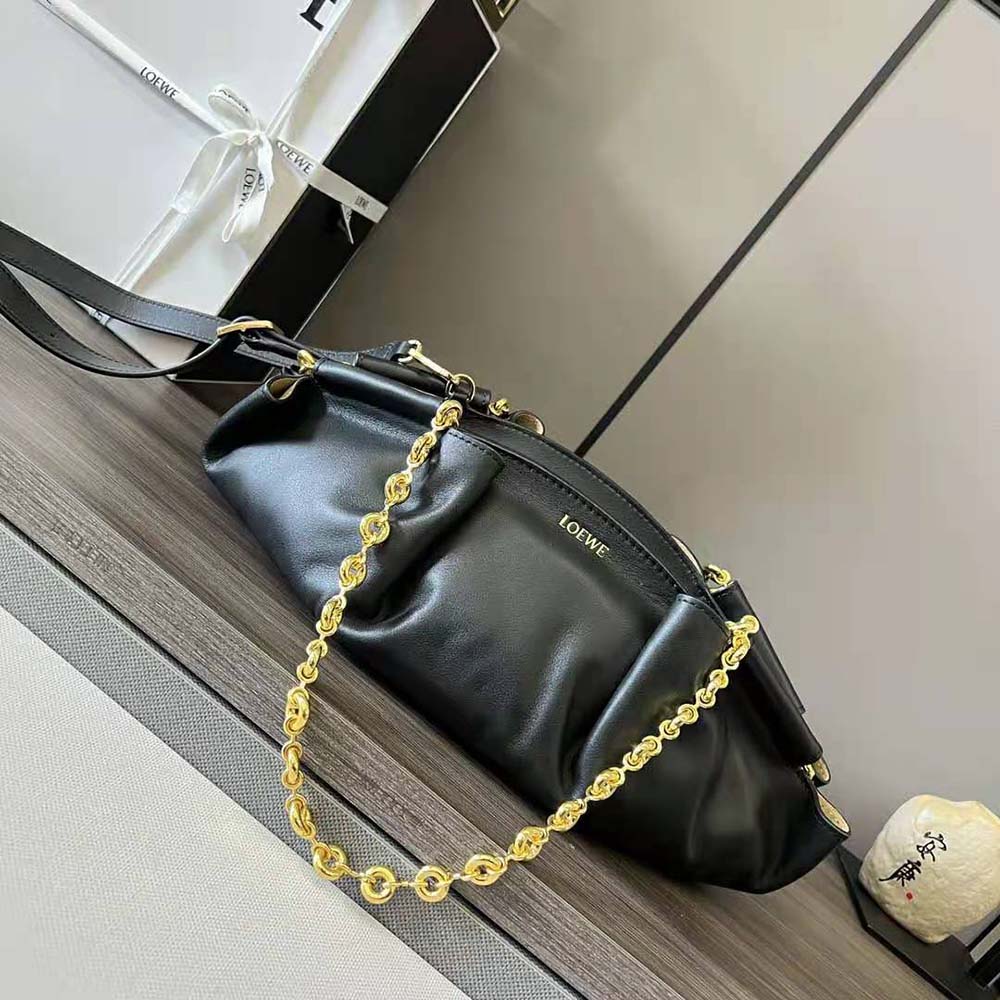 Close-up of chain strap and polished silver hardware on Loewe Small Paseo Bag