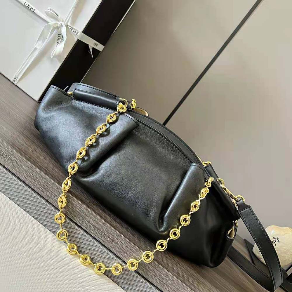 Side angle showing compact silhouette of Loewe Women Small Paseo Bag Black