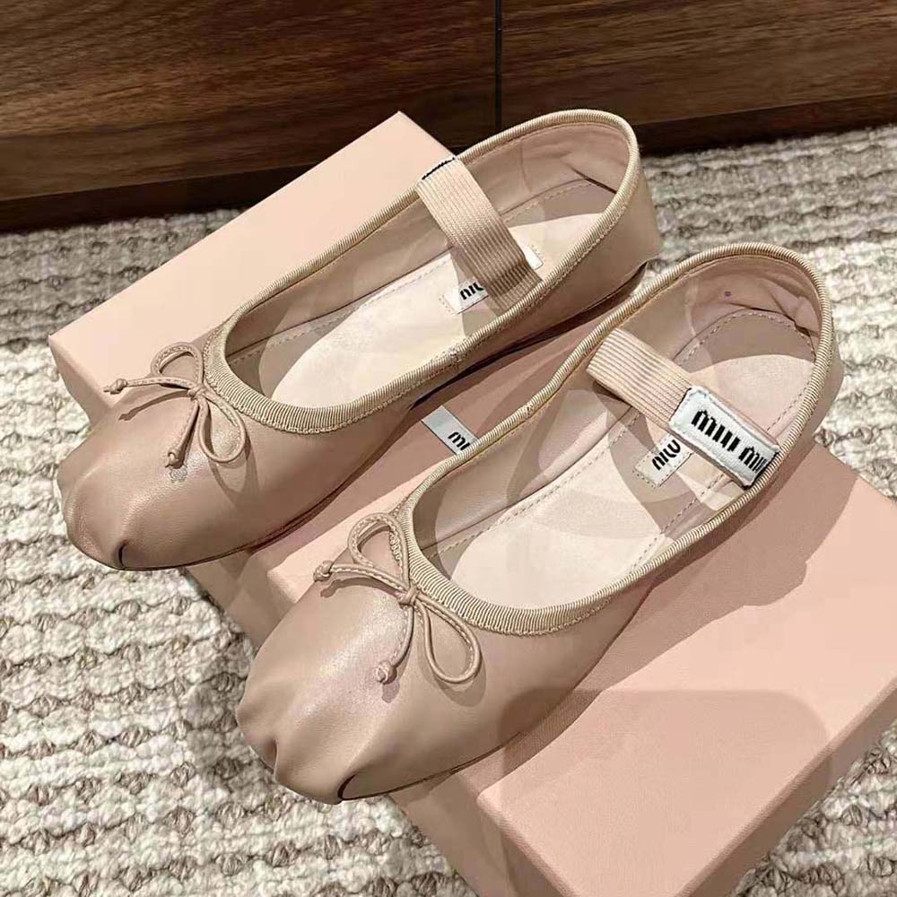 Top view showing smooth leather upper of Miu Miu beige ballerinas