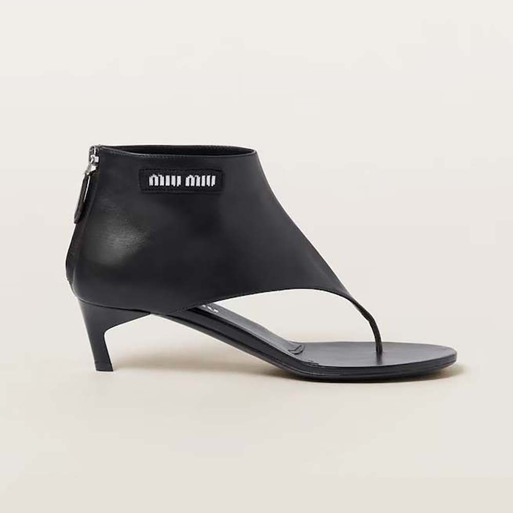 Side view of Miu Miu Women Leather Thong Booties-Black showing heel