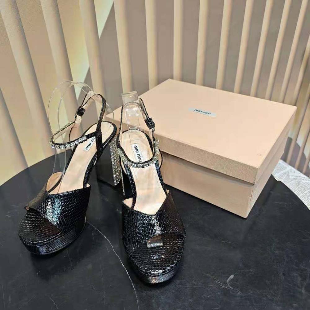 Side view showing chunky platform and silver buckle on Miu Miu sandals