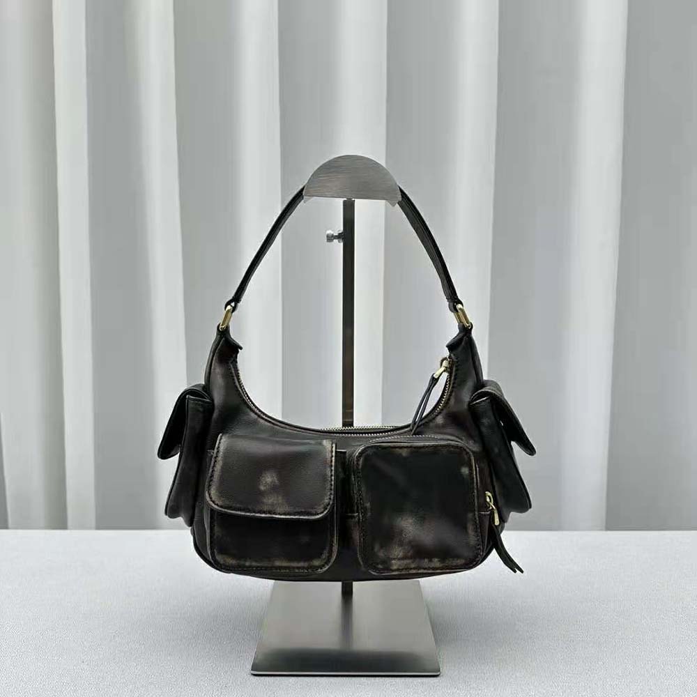 Side angle of Miu Miu Women Nappa Leather Pocket Bag-Black with shoulder strap visible