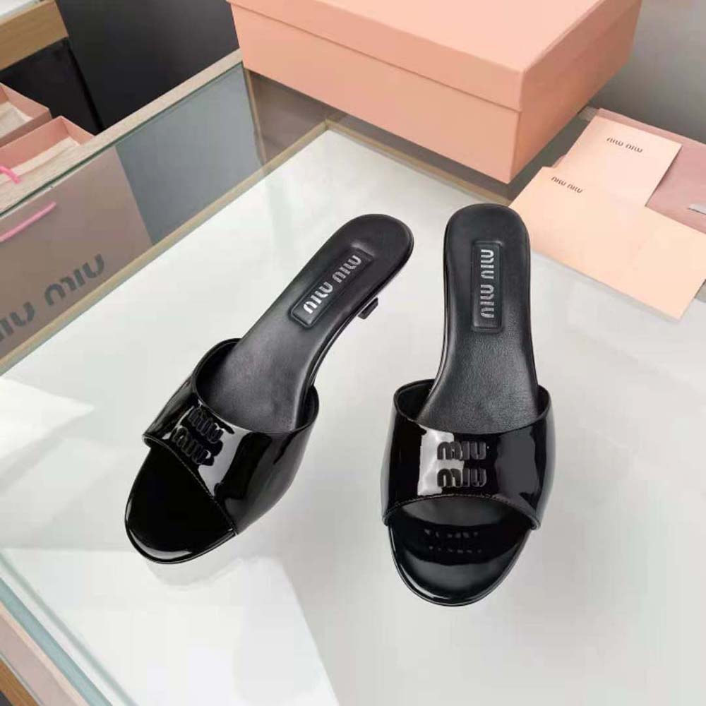 Rear angle showing the slender 45 mm block heel of Miu Miu sandals