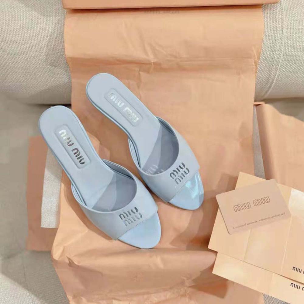 Close-up of polished silver buckle on Miu Miu Women Patent Leather Sandals