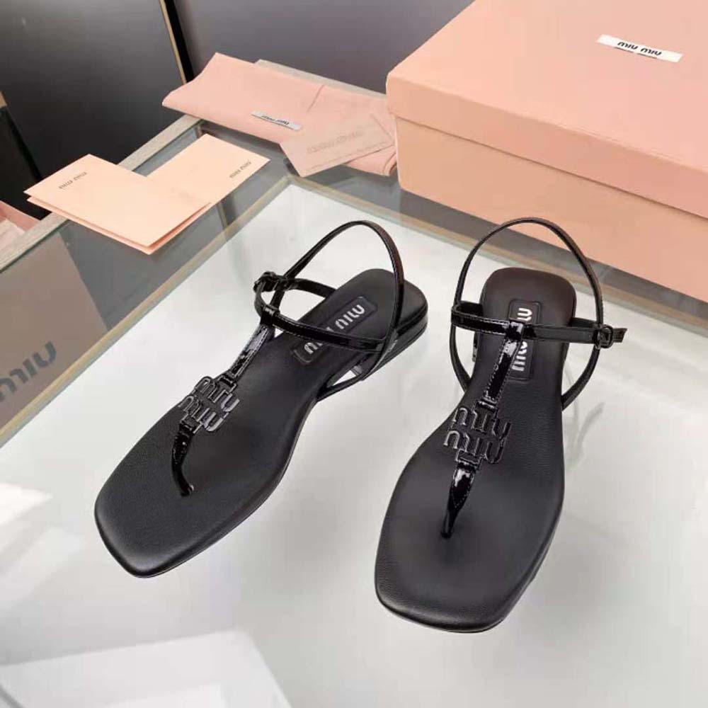 Close-up of metal lettering logo detail on Miu Miu Women Patent Thong Sandals