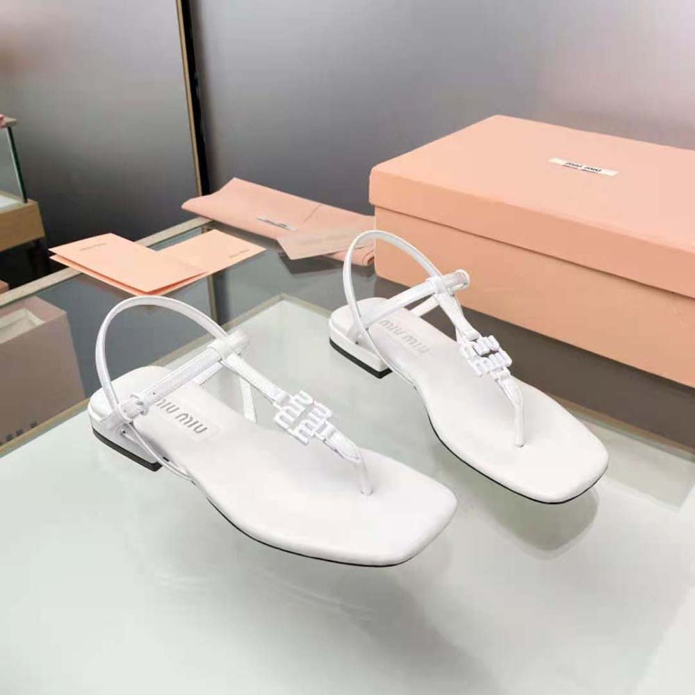 Overhead shot showcasing sleek silhouette of Miu Miu Women Patent Thong Sandals