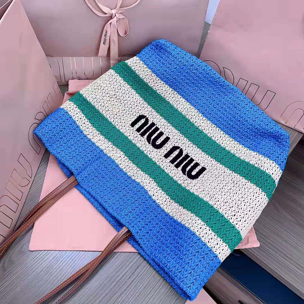 Side angle showing spacious silhouette of Miu Miu Women Woven Fabric Tote Bag-Blue