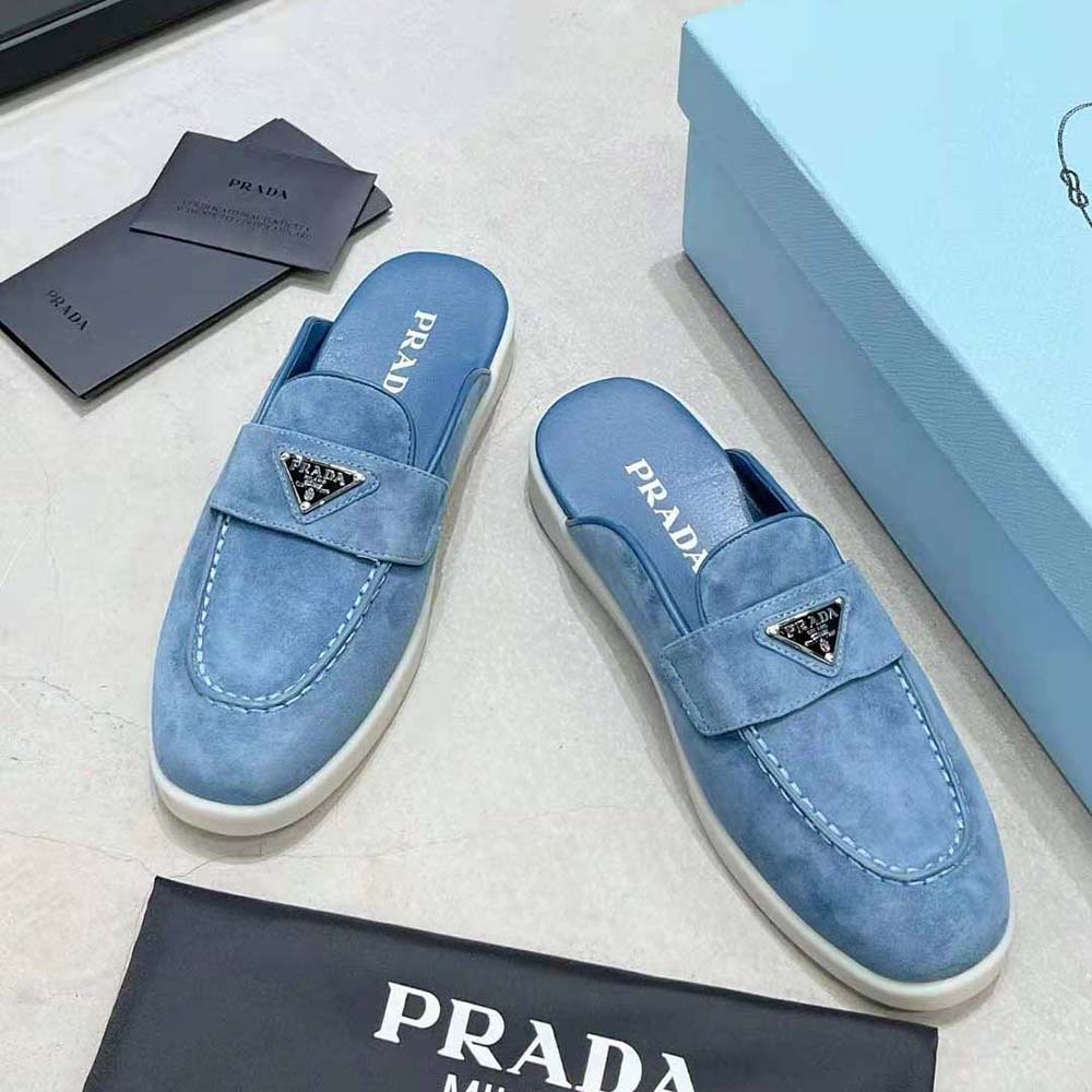Top-down angle showing open heel design of Prada Men Suede Sabots blue loafers