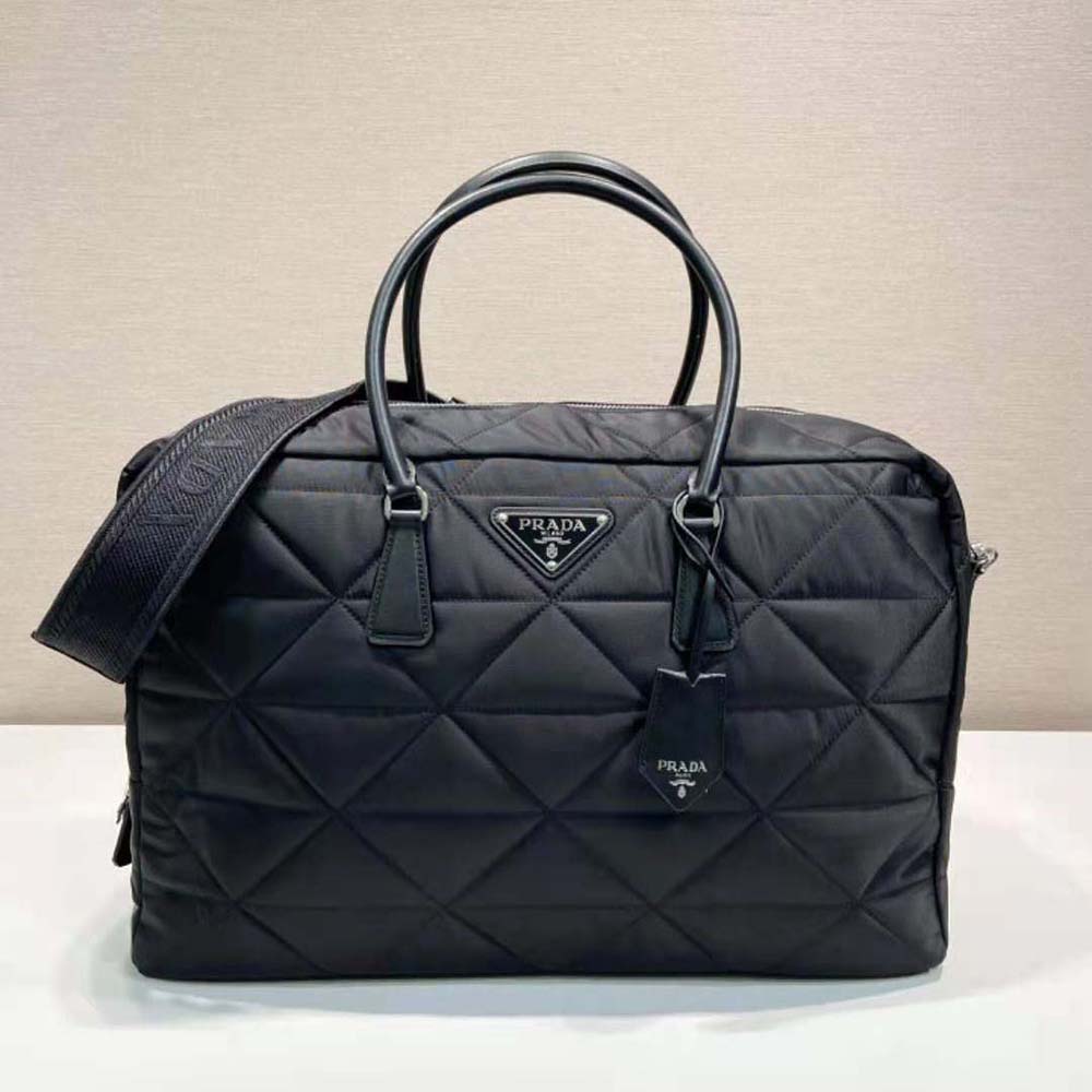 Close-up of silver-tone hardware and zip on Prada Unisex Quilted Re-Nylon Travel Bag-Black