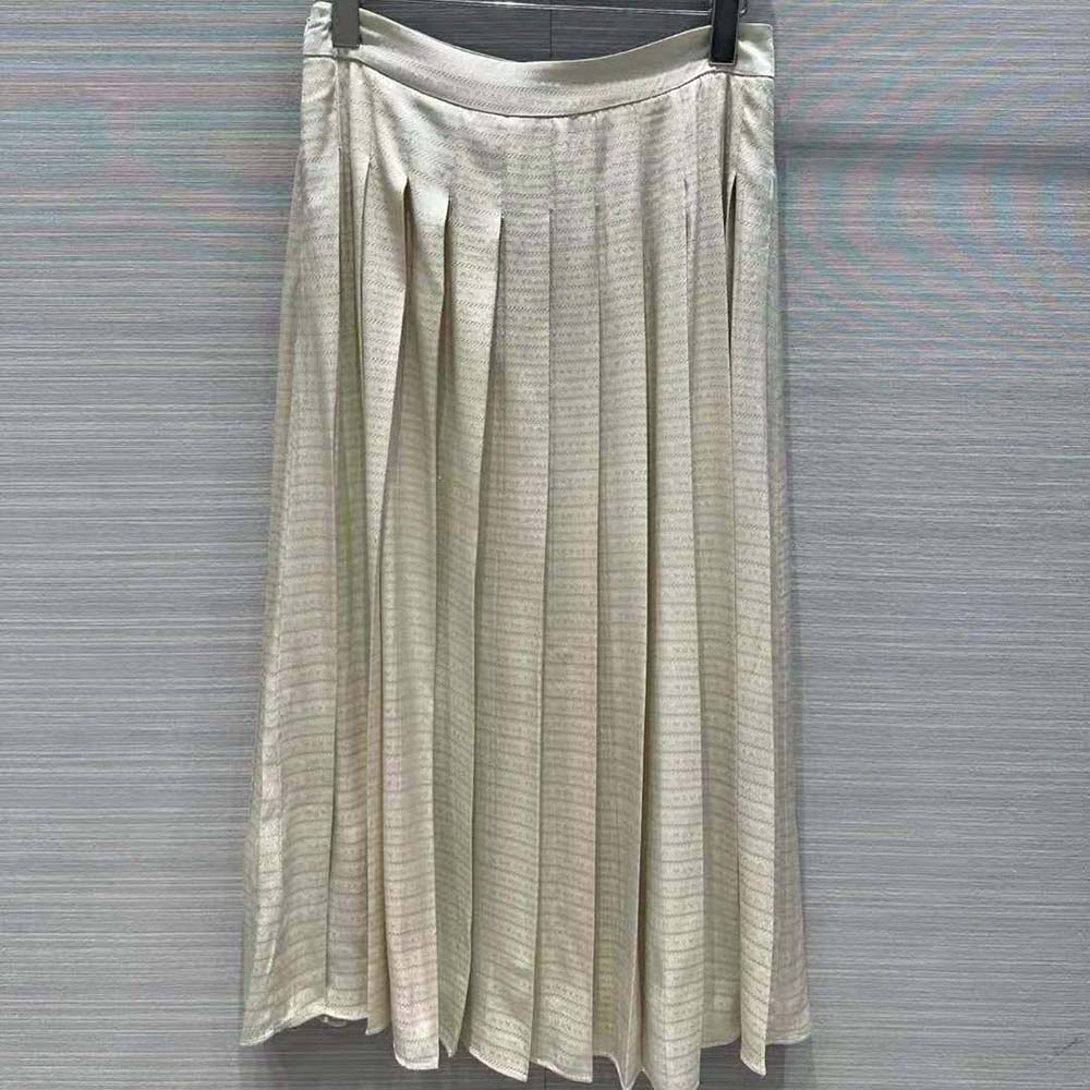 Side angle showing length and silhouette of Prada beige skirt