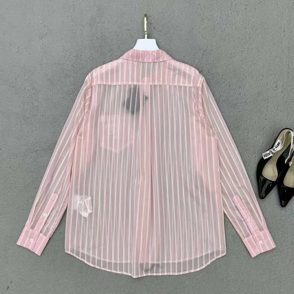 Side angle showcasing relaxed fit of Prada Women Embroidered Poplin Shirt in pink