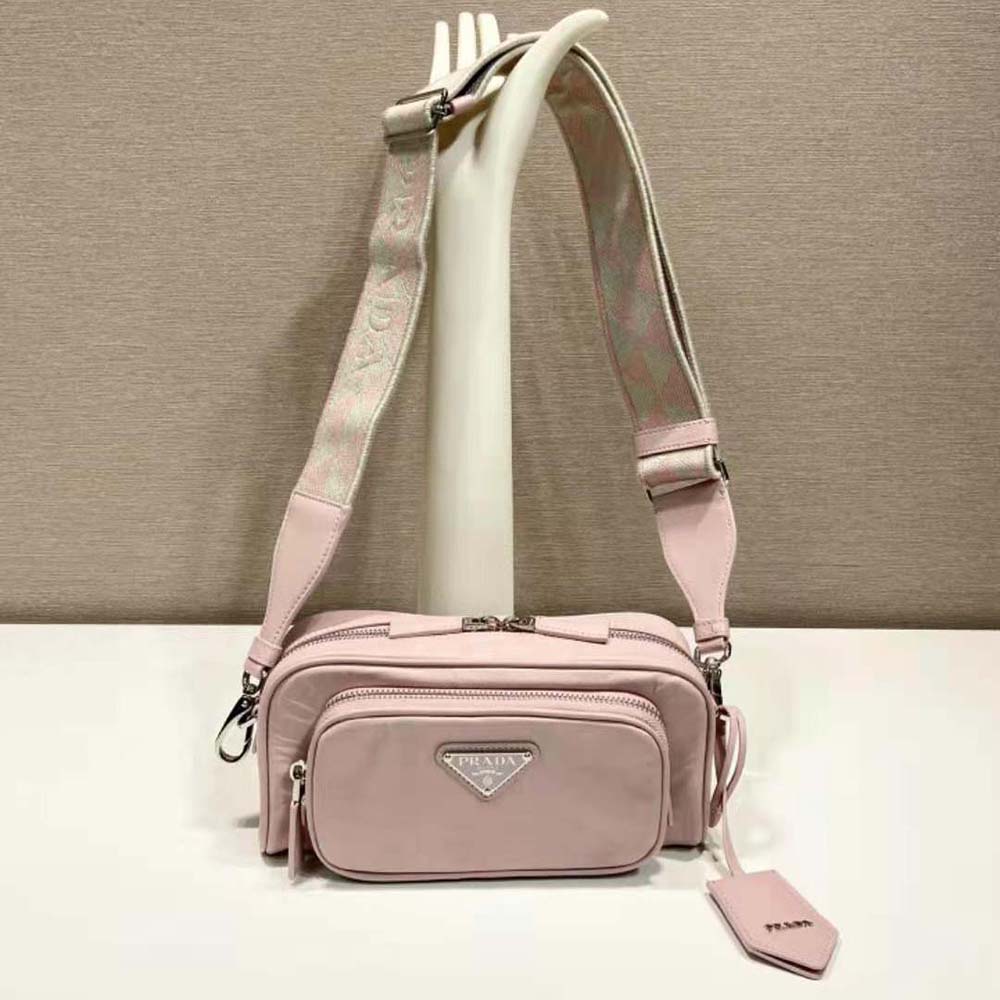 Close-up on silver hardware and pink nappa leather texture