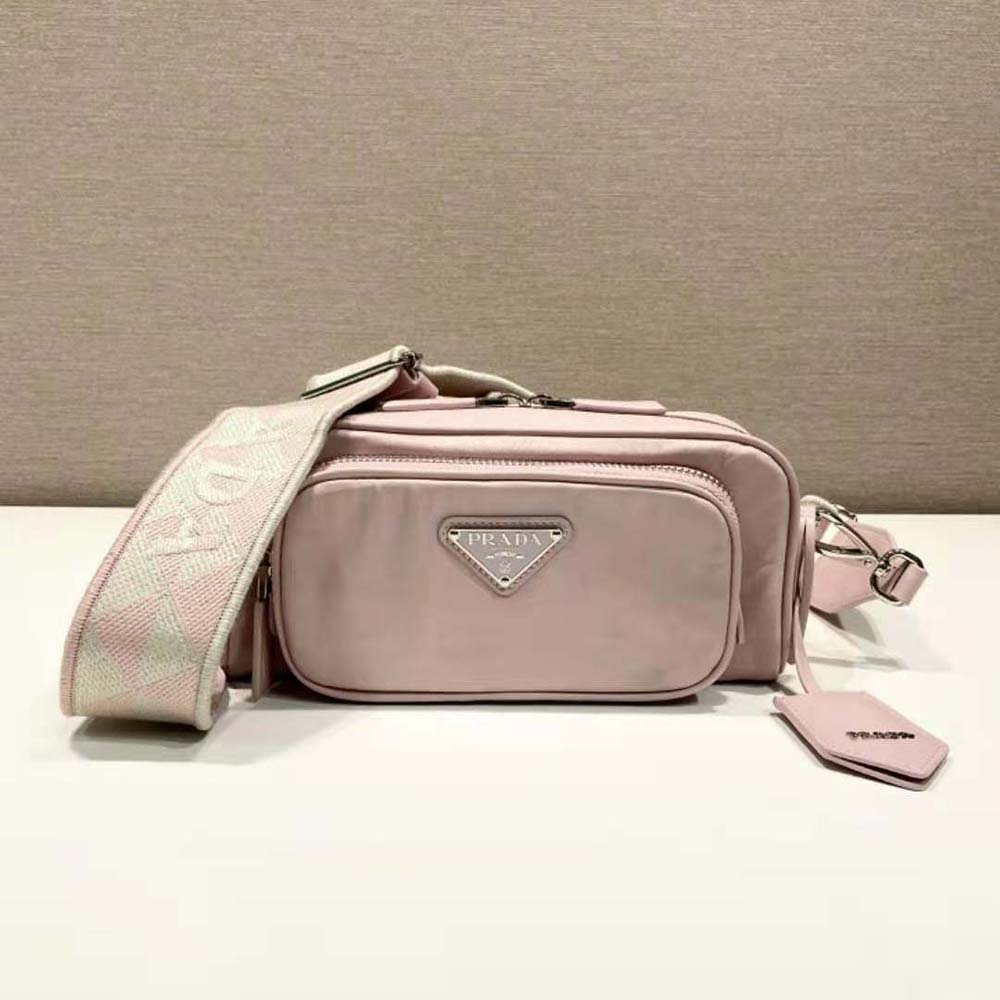 Side angle showing multiple pockets and adjustable strap of Prada shoulder bag
