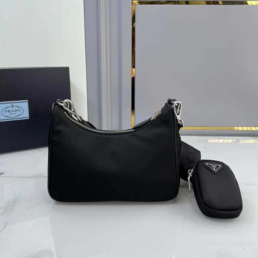 Side angle showing adjustable shoulder strap of Prada Women Re-Edition 2005 Re-Nylon Bag-Black
