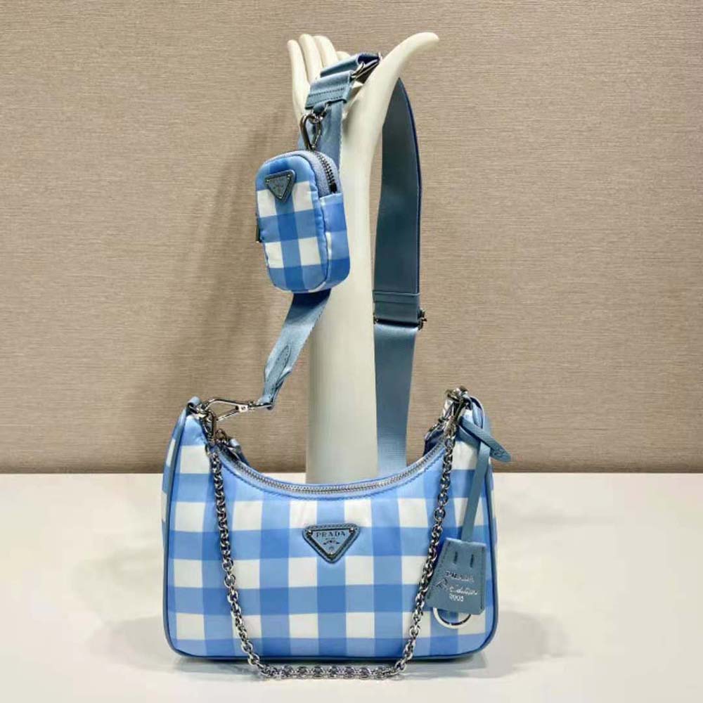 Close-up of silver hardware and blue Re-Nylon fabric on Prada bag