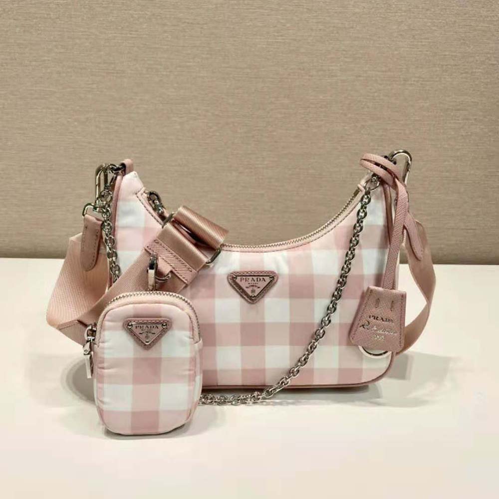 Side profile showing adjustable shoulder strap of Prada Women Re-Edition bag