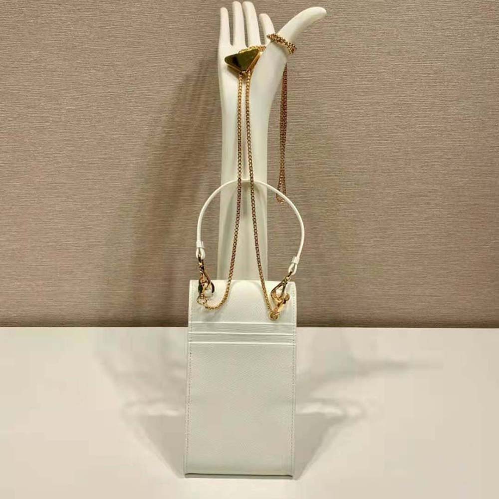 Side angle showing compact silhouette of Prada Women Saffiano Leather Mini-Bag-White