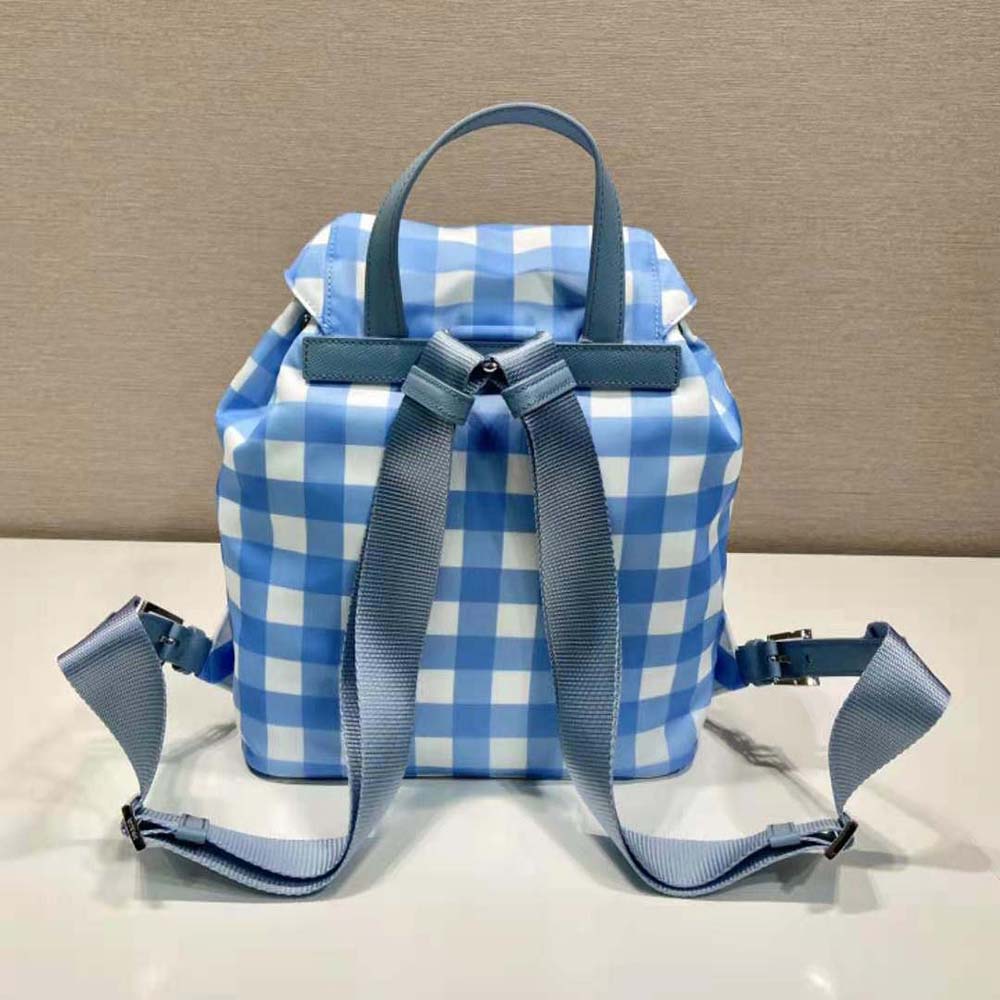 Side angle showing adjustable straps on Prada Women Small Printed Re-Nylon Backpack-Blue