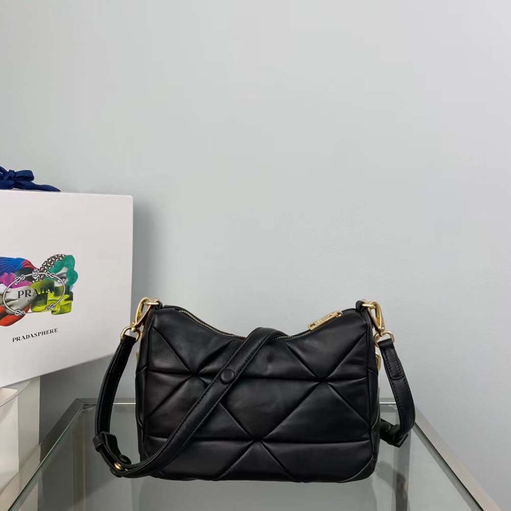 Side angle showing silver hardware on Prada Women System Nappa Leather Patchwork Bag-Black