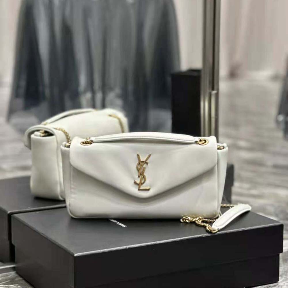 Close-up of gold YSL logo on Saint Laurent YSL Women Calypso bag