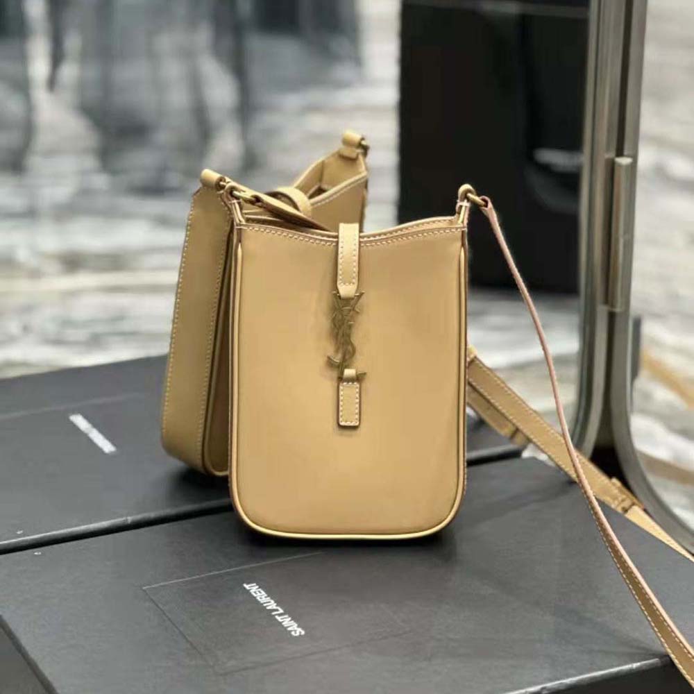 Close-up of gold-tone YSL hardware on mini vertical shoulder bag