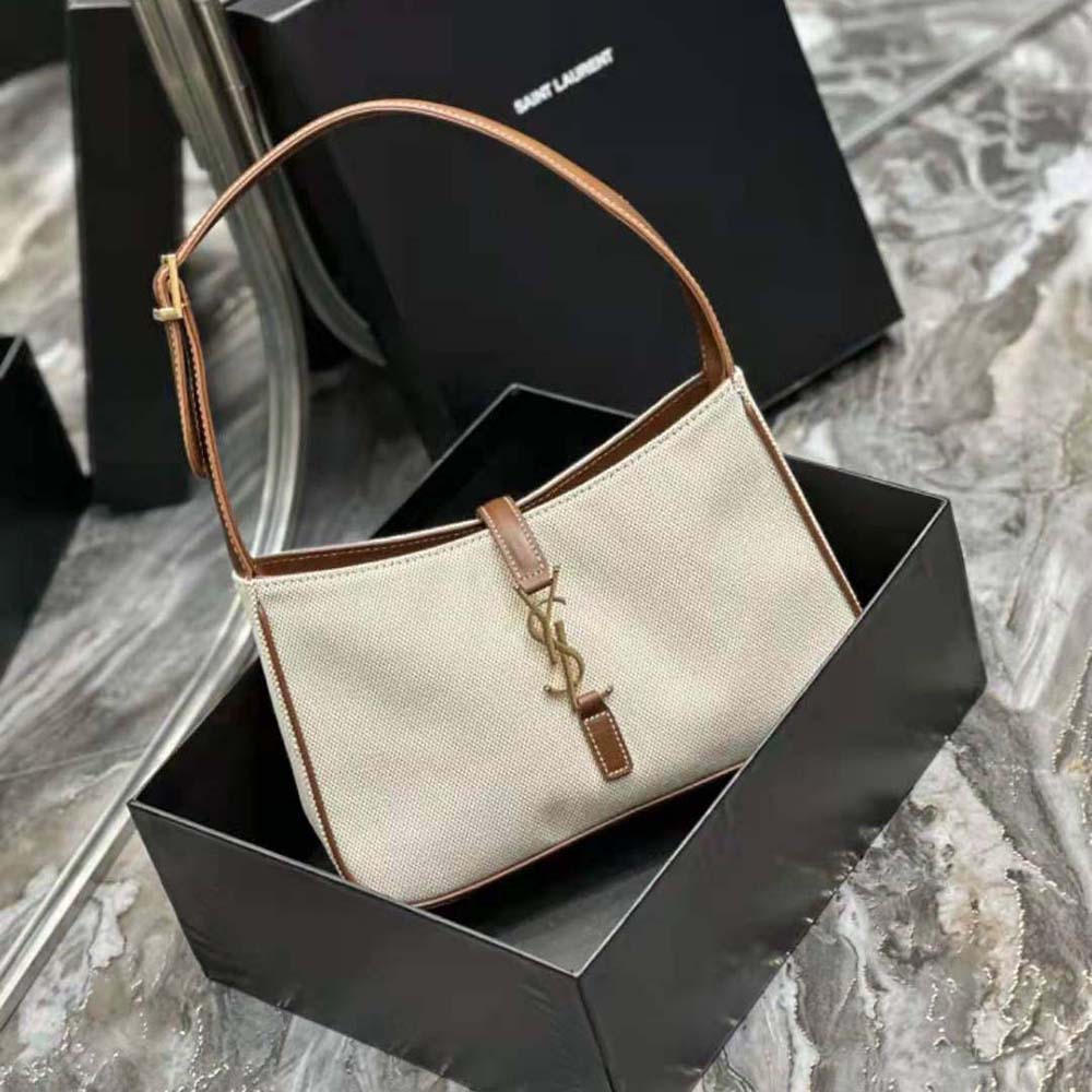 Side angle showing adjustable strap and textured canvas of Saint Laurent YSL Women Le 5 à 7 bag