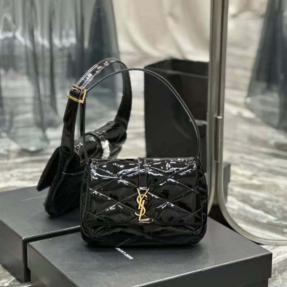 Close-up of gold YSL logo hardware on Saint Laurent YSL Women Le 57 Hobo Bag