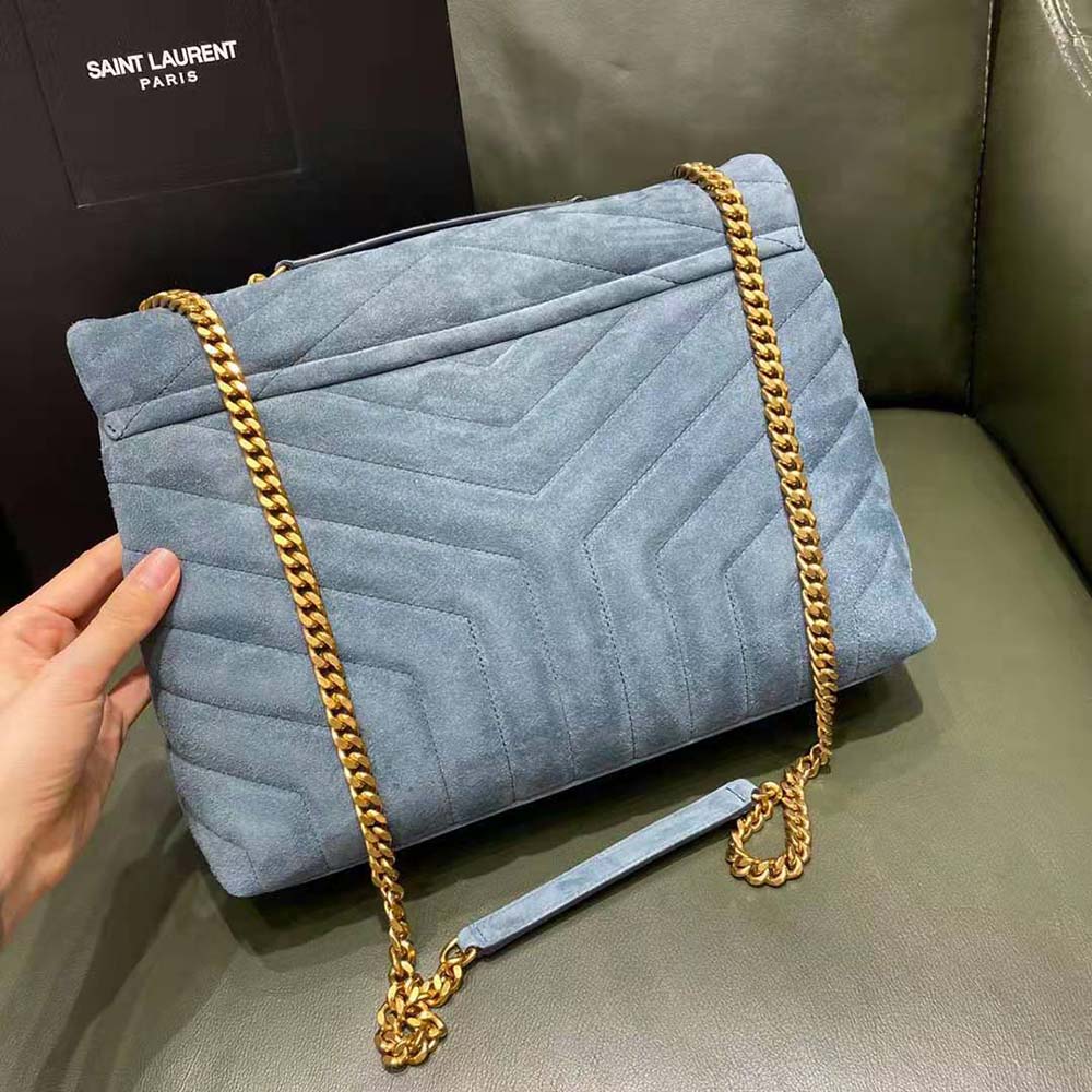 Side angle showing silhouette and suede texture of Saint Laurent Loulou bag