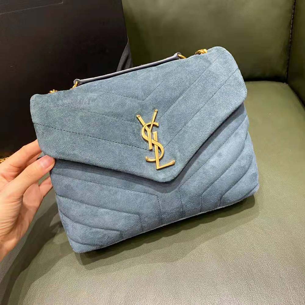 Close-up of Y-quilted pattern and silver chain on YSL bag