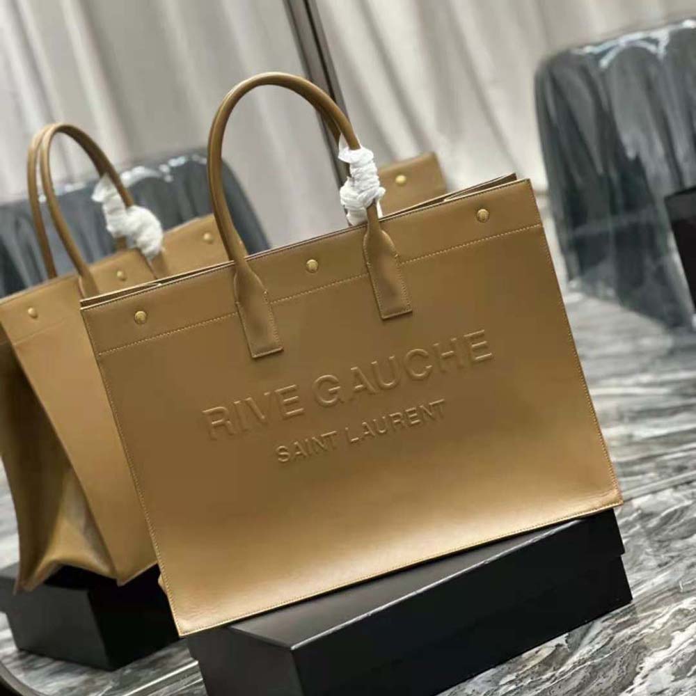 Side angle showing structured silhouette of Saint Laurent YSL large tote