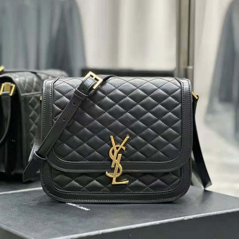 Close-up detail of gold YSL clasp on Solferino Medium Supple Satchel black bag
