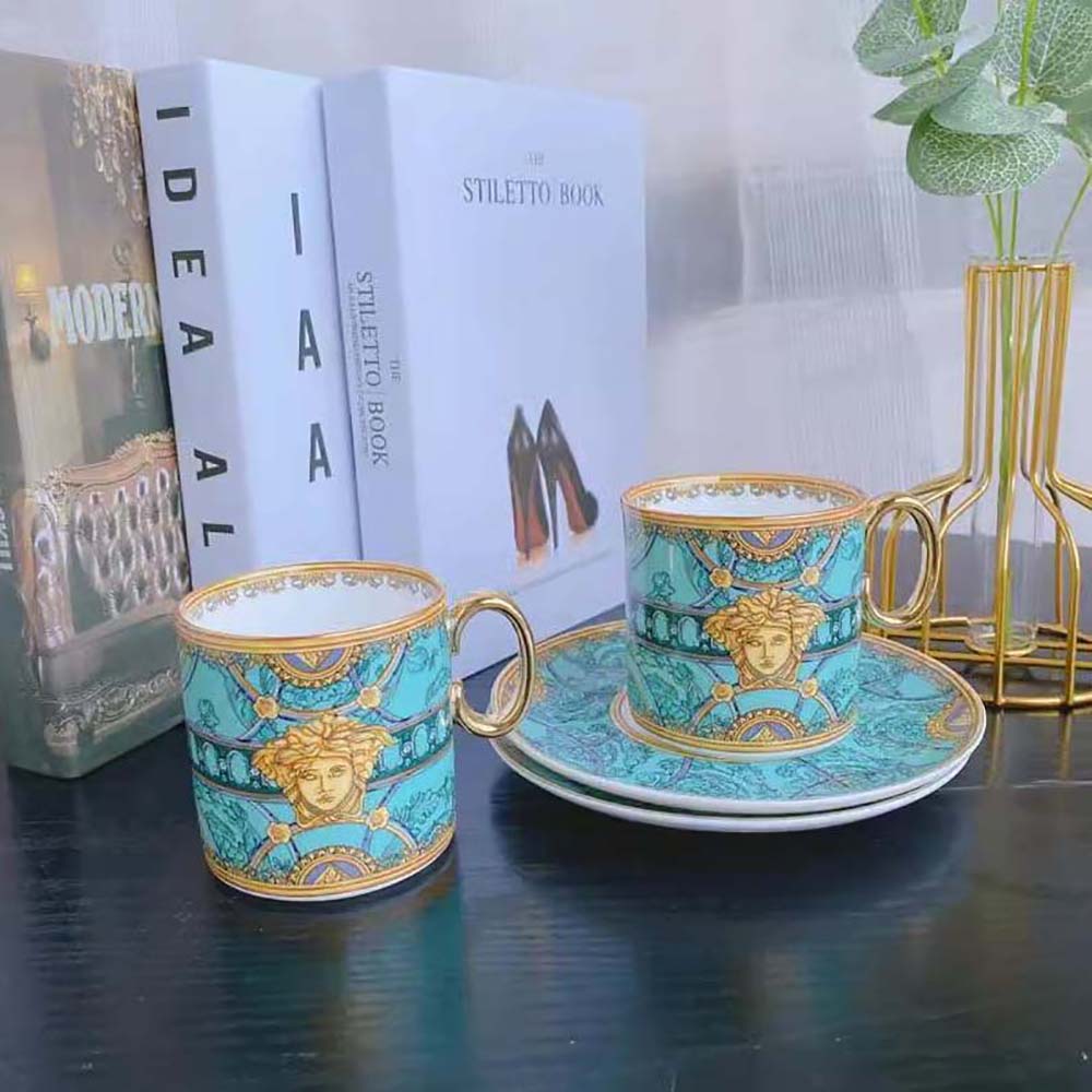 Close-up of Versace Medusa motif on Scala Del Palazzo coffee cup