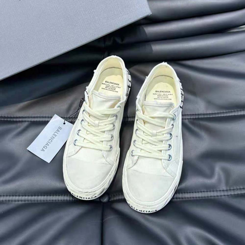 Close-up on graffiti print and leather texture of Balenciaga sneaker