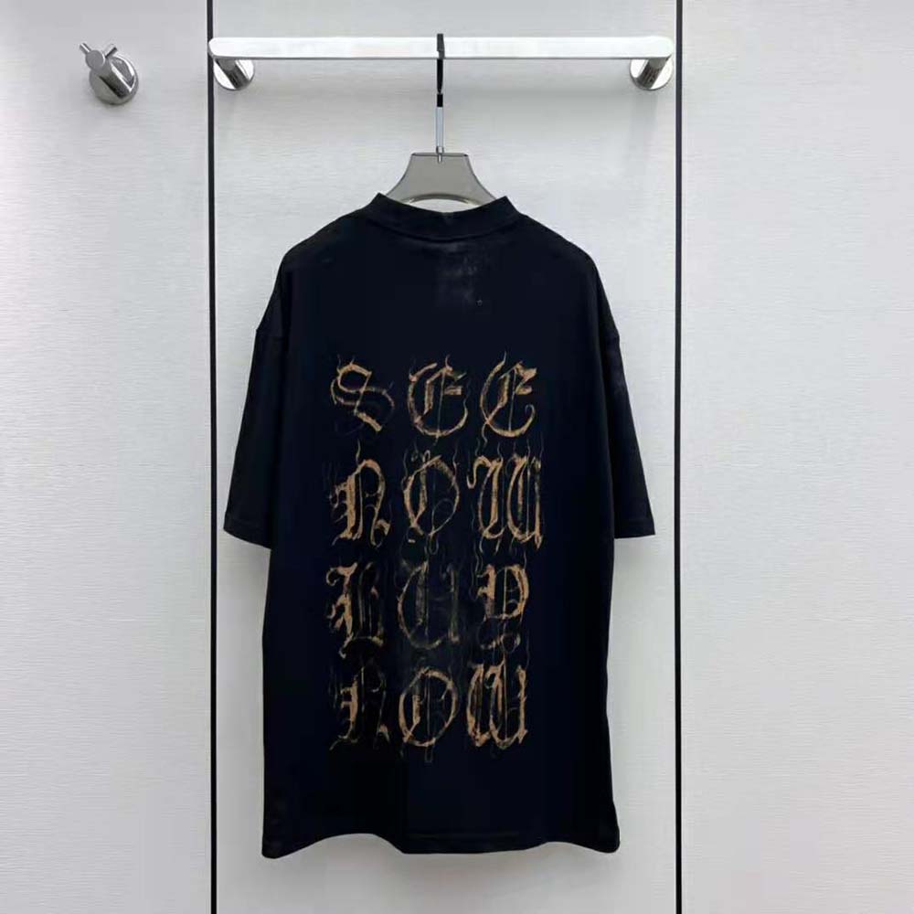 Close-up of black faded fabric and heavy metal logo on Balenciaga women's t-shirt