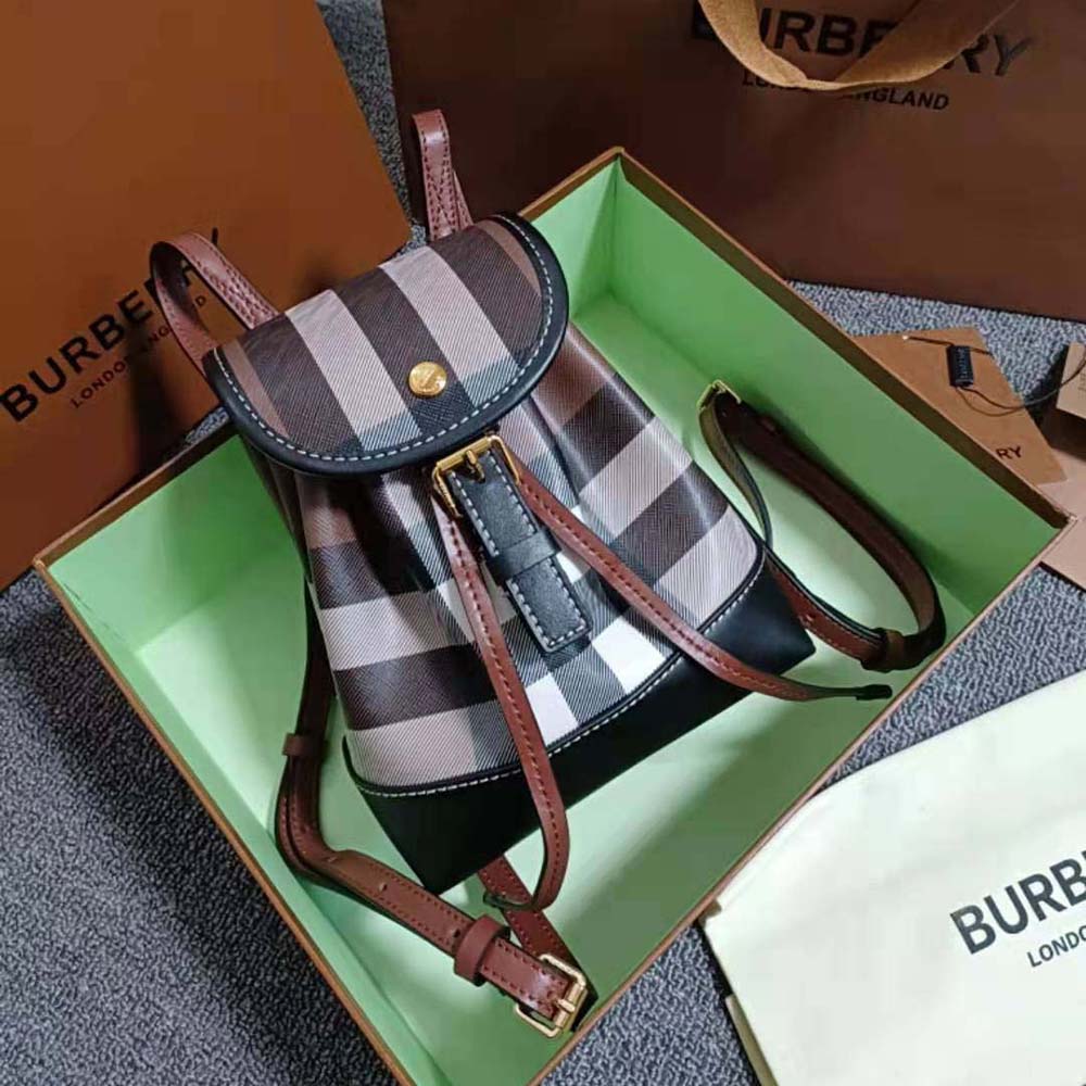 Close-up of gold-tone hardware on Burberry Women Check Micro Backpack