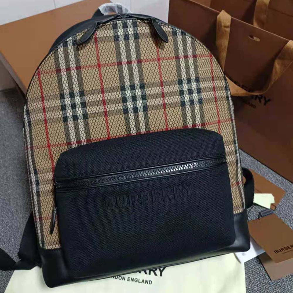 Close-up of Burberry check fabric and mesh detail on backpack