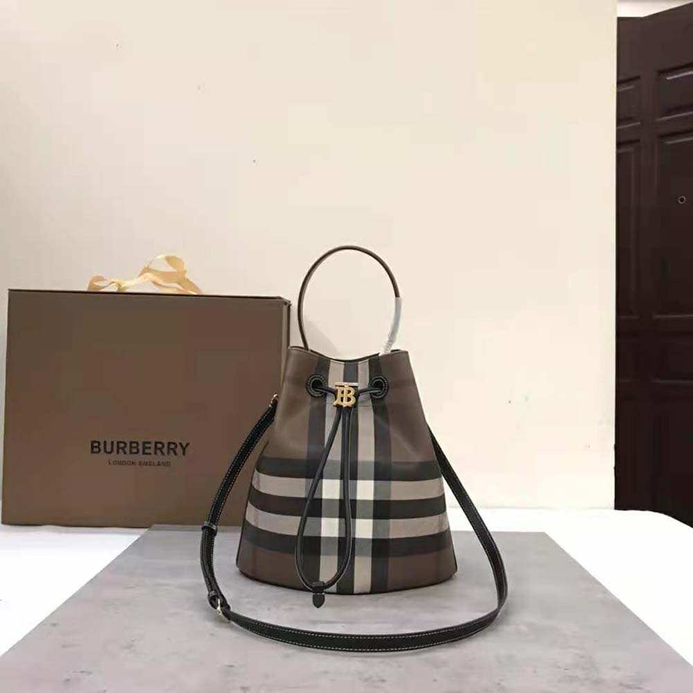 Close-up of gold-tone TB clasp on Burberry Women Mini TB Bucket Bag