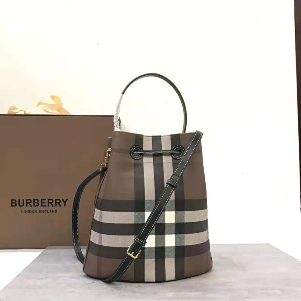 Side angle showcasing silhouette of Burberry Women Mini TB Bucket Bag