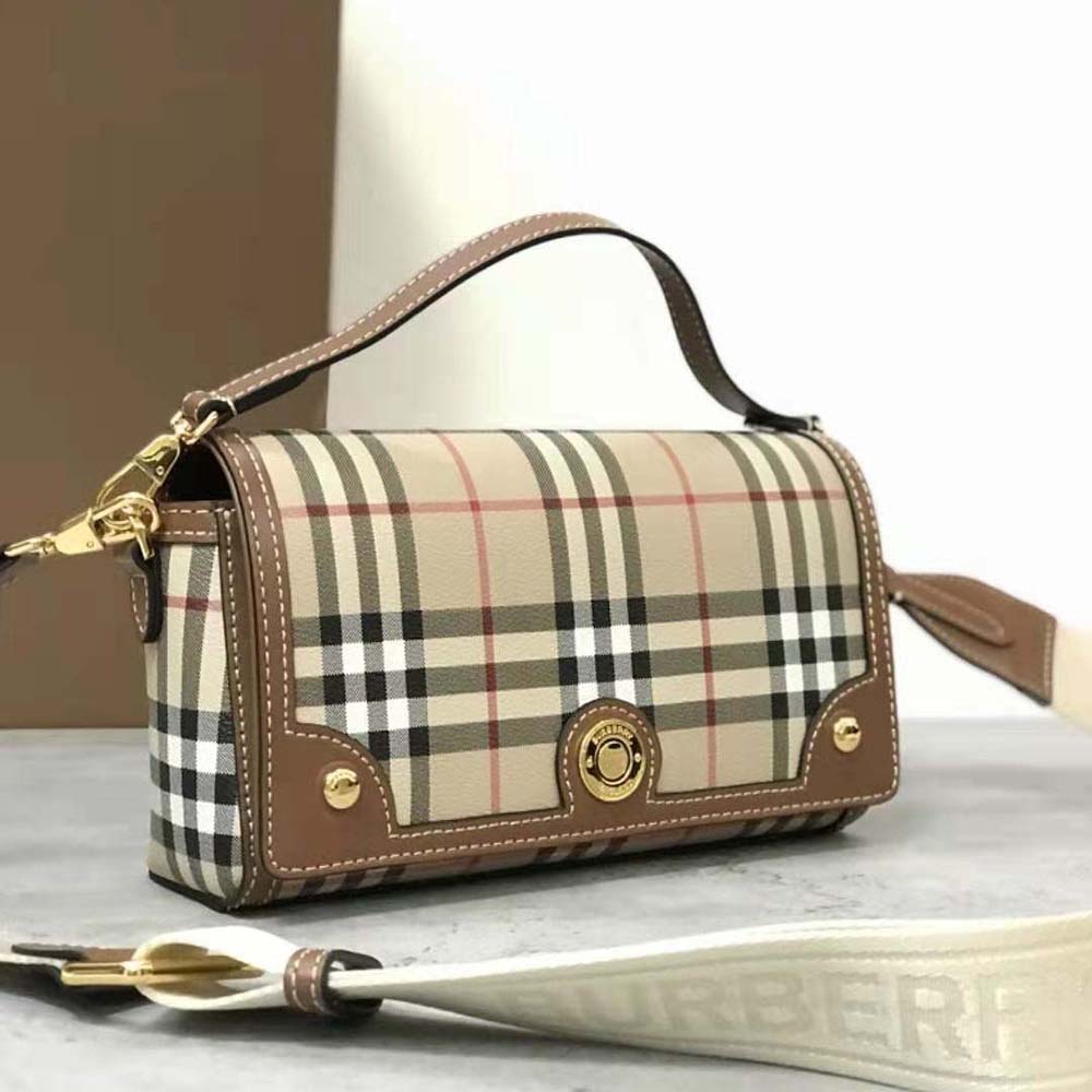 Side profile showing silhouette of Burberry Women Top Handle Note Bag in brown