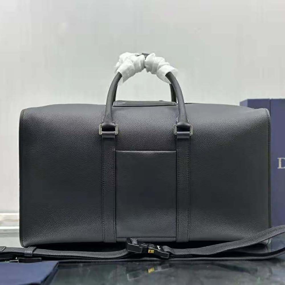 Side angle showing slim profile of Dior Men By Erl Dior Lingot 50 Bag