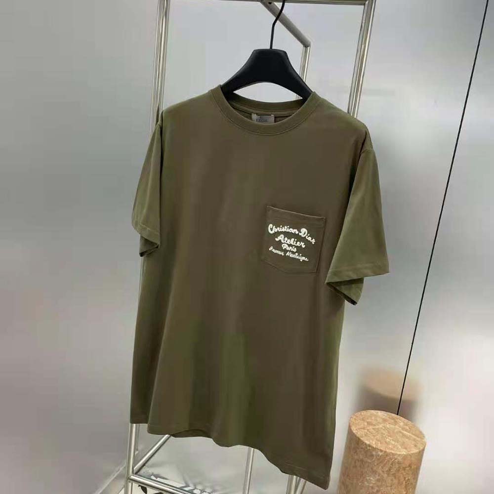 Side angle showing fit and fabric texture of Dior Men green cotton jersey T-shirt