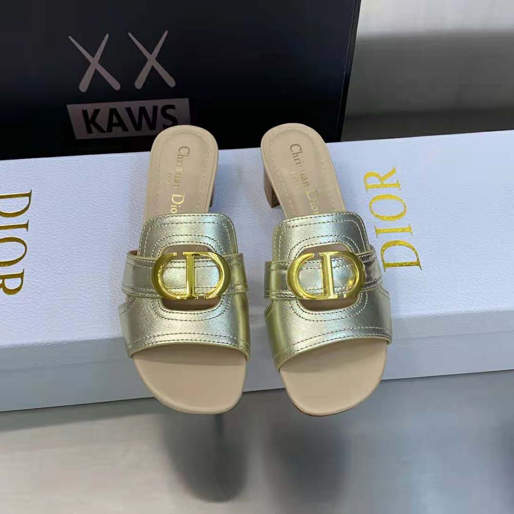 Close-up of gold hardware detail on Dior Women 30 Montaigne Heeled Slide