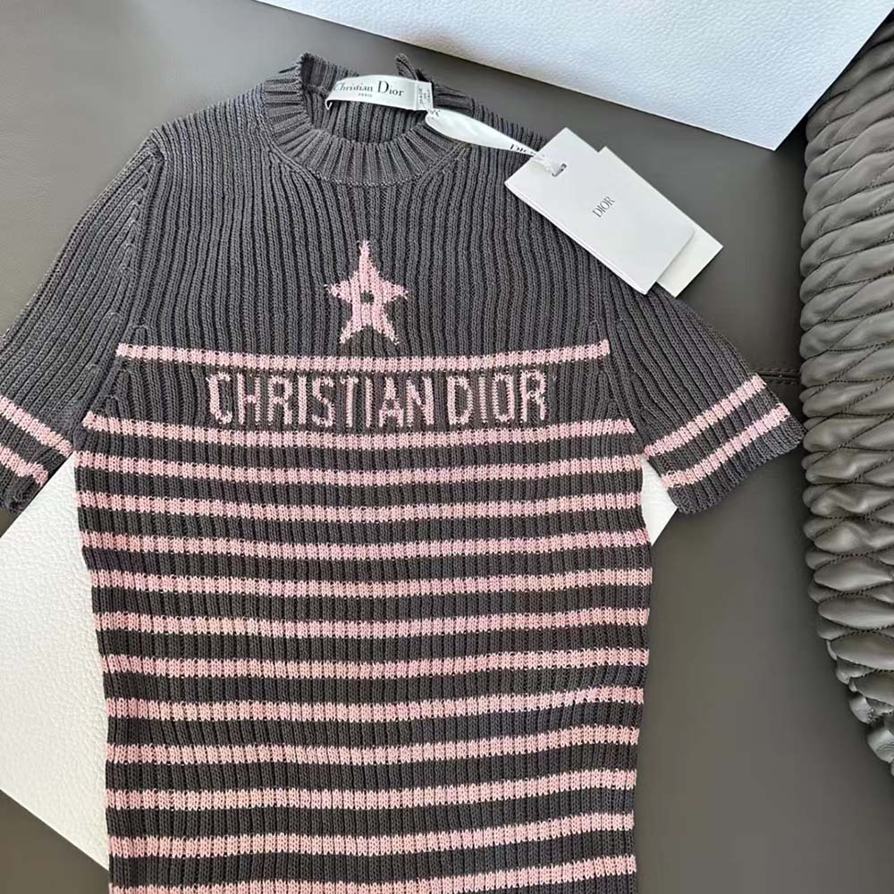 Side angle showing short sleeves and relaxed fit of Dioriviera sweater