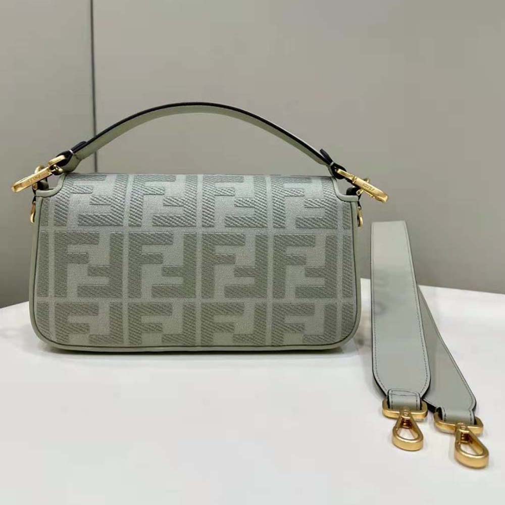 Side angle showing silver-tone hardware on Fendi Women Baguette Light Green Canvas Bag