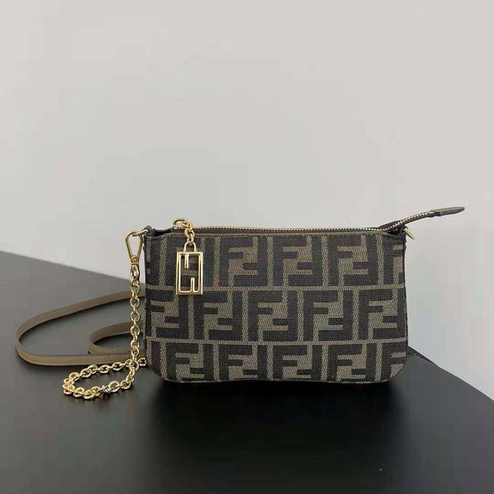 Close-up of jacquard FF fabric and gold chain on Fendi pouch