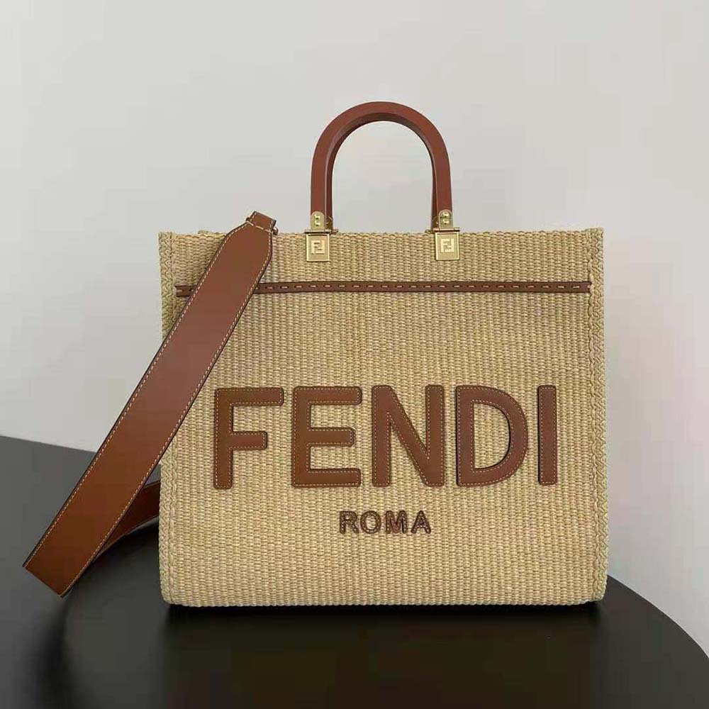 Close-up of gold-tone hardware and signature logo on Fendi Sunshine bag