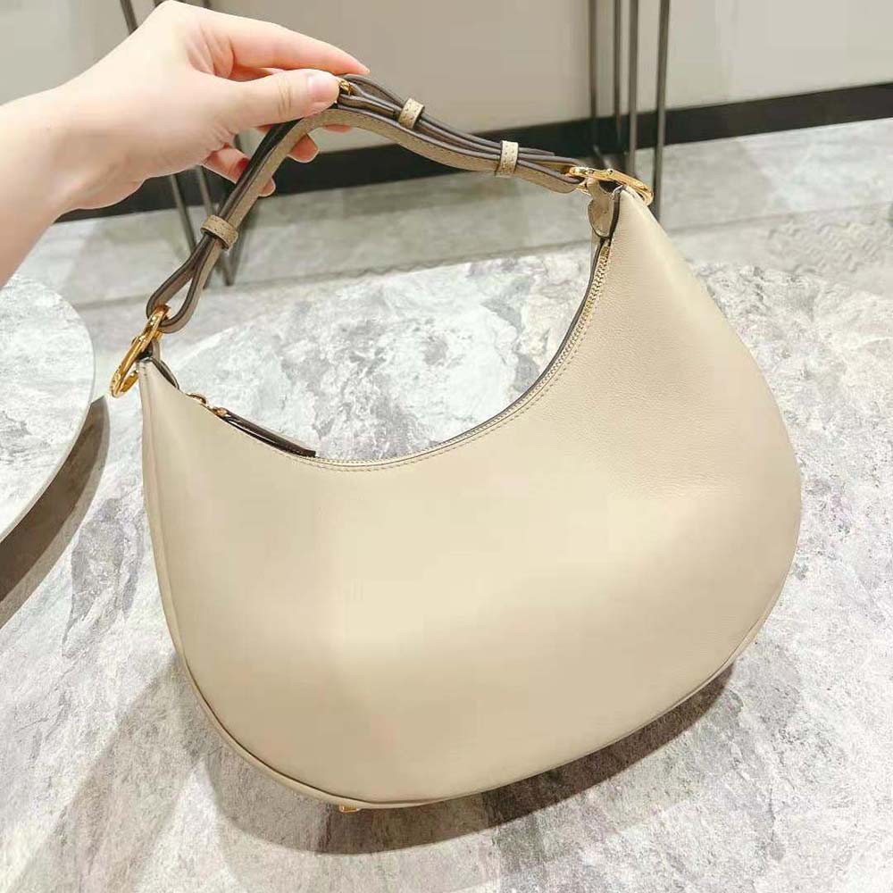 Side angle showing shape and texture of Fendi Women Fendigraphy Small Beige Leather Bag