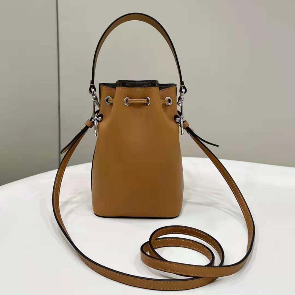 Side angle showing gold-tone hardware on Fendi Women Mon Tresor mini-bag