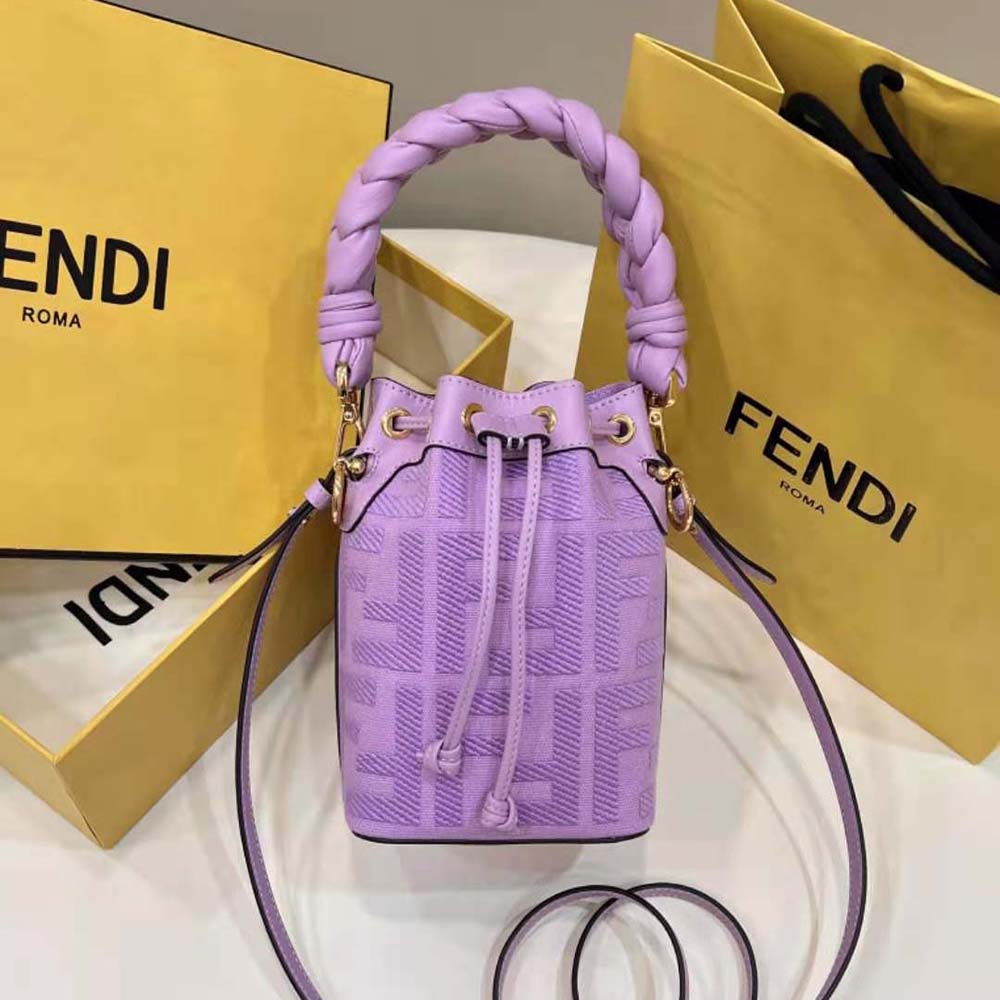 Close-up of gold-tone double-F logo on purple mini-bag