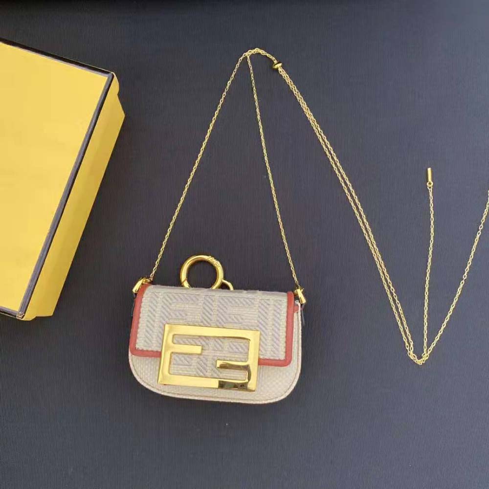Close-up on gold-tone hardware detail of Fendi Nano Baguette Charm